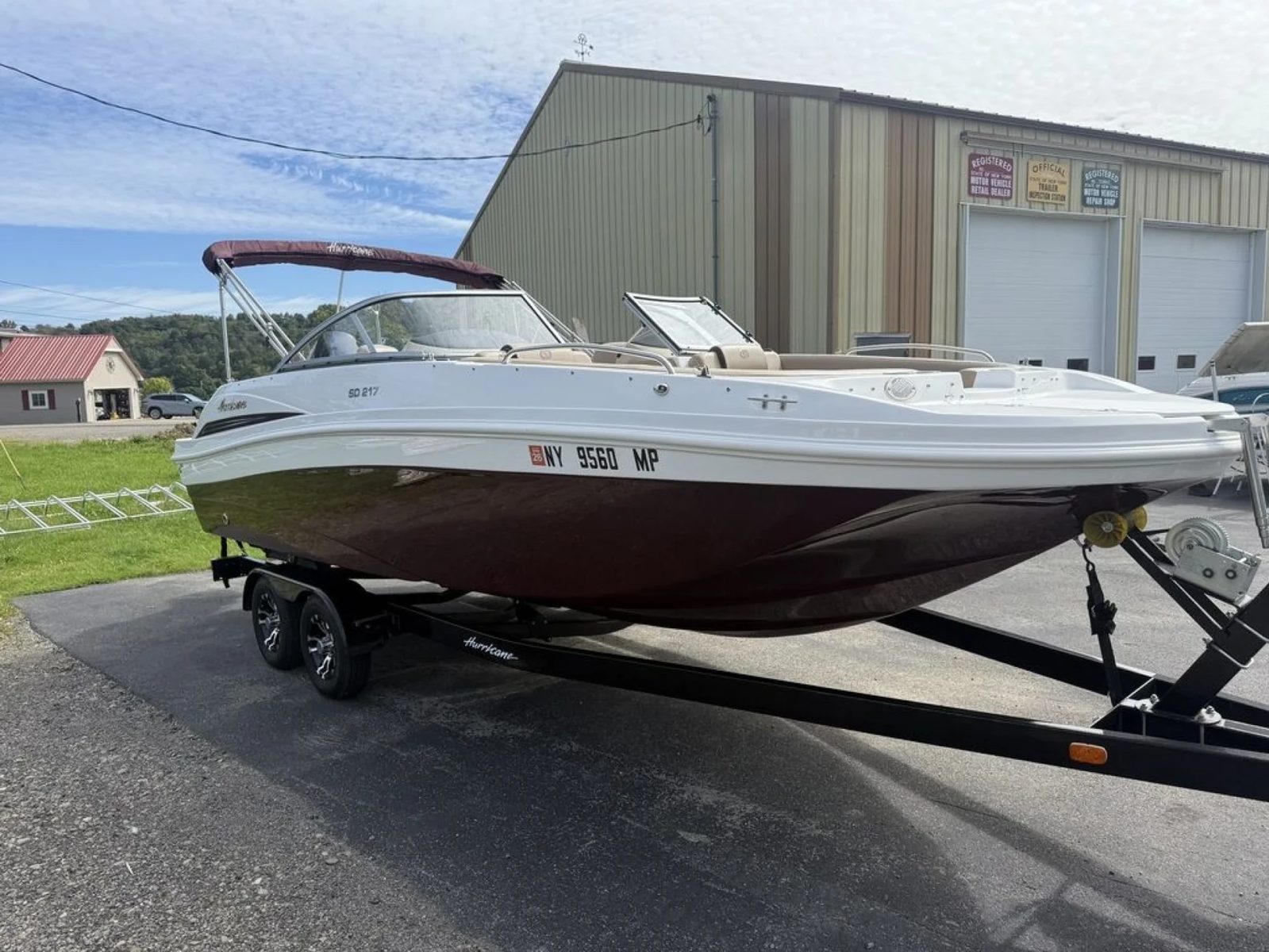 A Hurricane deck boat on its trailer outside the Lime Lake store