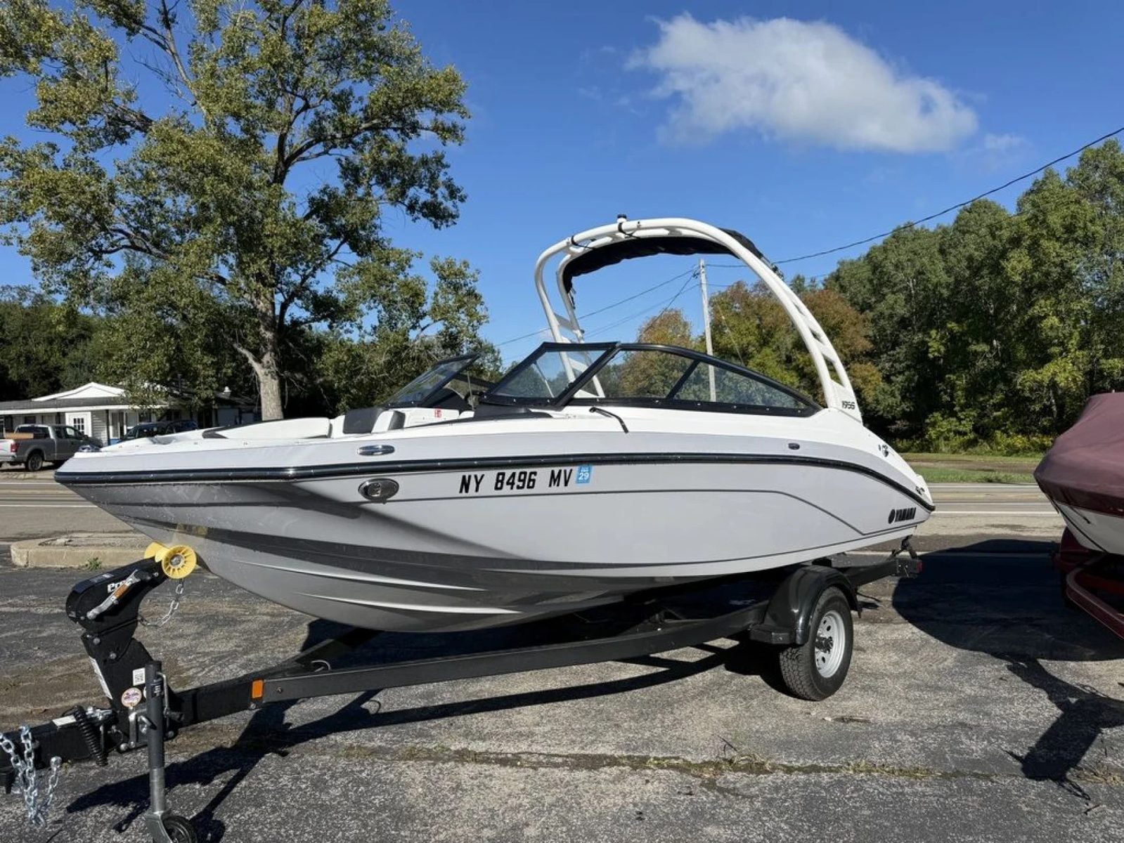 A Yamaha 195S jet boat on its trailer outside the Lime Lake store