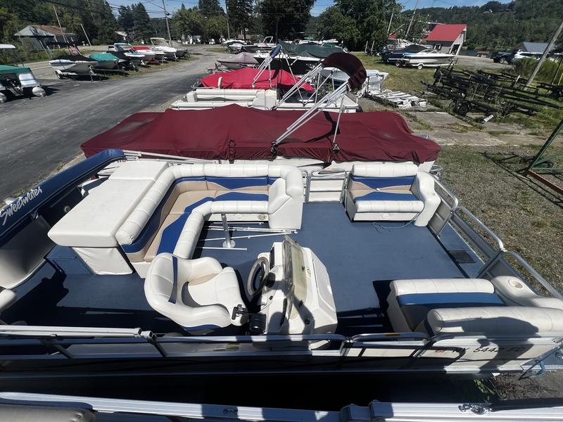 The deck of a pontoon on the Lime Lake Marine & RV lot
